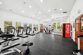 24/7 Fitness center with cardio and strength training equipment